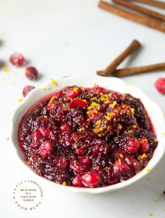 HOMEMADE CRANBERRY SAUCE - real cranberries, sugar , orange juice, water, cinnamon stick is all it takes for fresh, flavorful cranberry sauce #cranberry #thanksgiving #sidedish #cleaneating #happilyunprocessed
