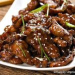 Mongolian beef on white plate