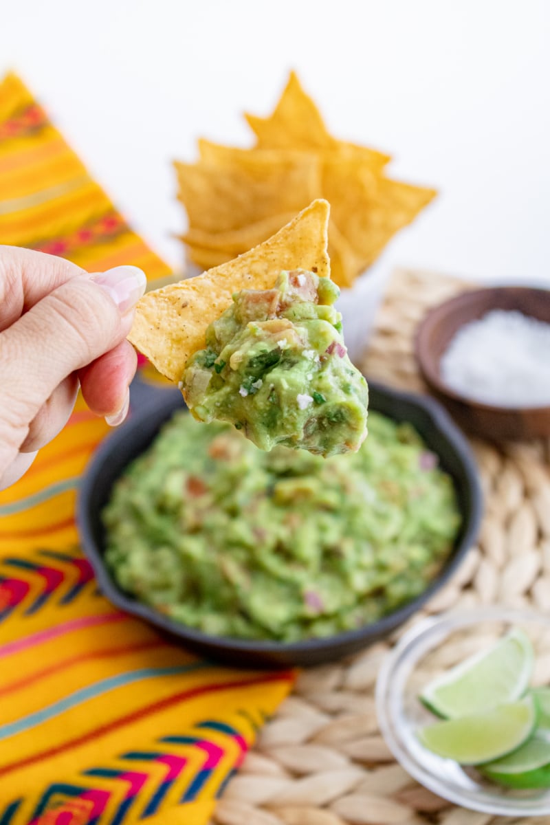 Freshly made guacamole on a tortilla chip