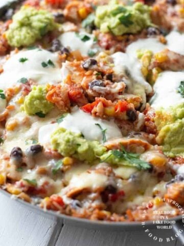 shredded chicken, black beans, corn, tomatoes and rice simmered in enchilada sauce topped with cheese in one skillet