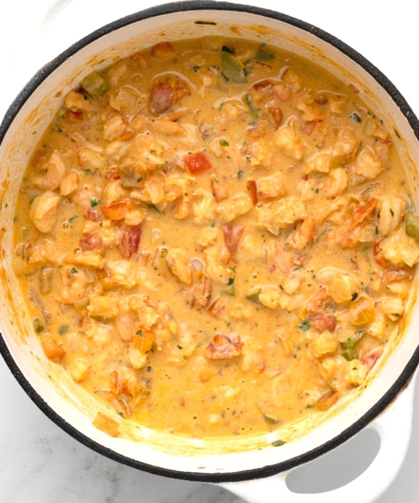 CREAMY SHRIMP ENCHILADAS - succulent shrimp inside an enchilada topped with a creamy cheesy sauce #seafood #shrimp #enchilada #happilyunprocessed
