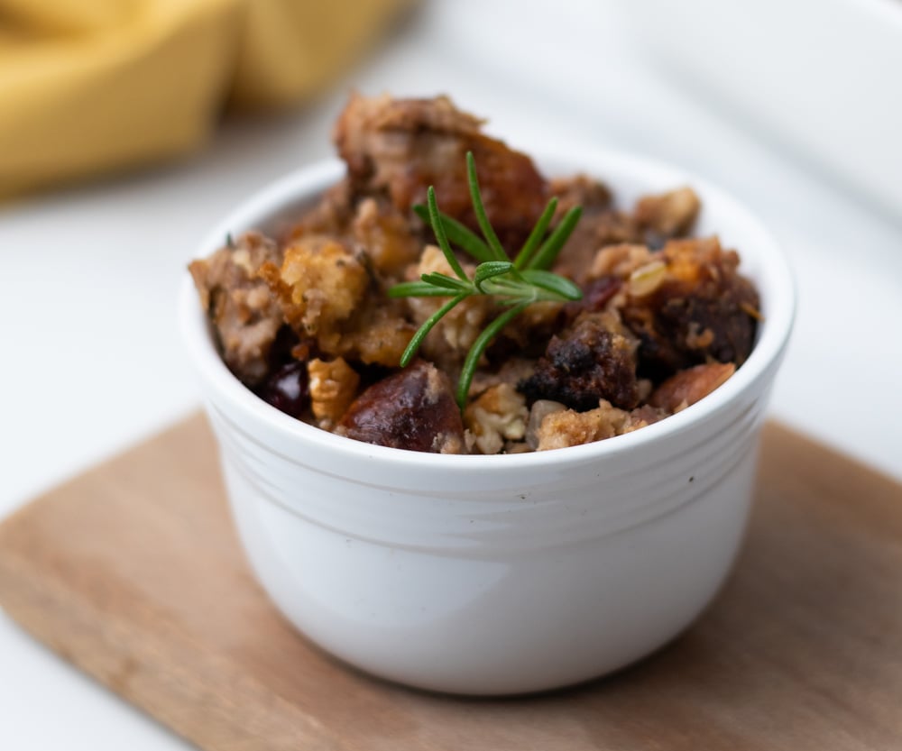 Slow cooker stuffing with sausage, herbs, cranberries and pecans - why wait for Thanksgiving? No turkey needed for this stuffing. Done in a few hours in the slow cooker! #stuffing #thanksgiving sides #sidedish #sausagestuffing