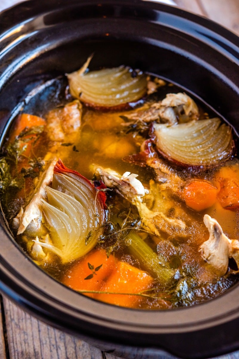 Crockpot Turkey Stock - don't throw away those leftovers. Bone broth is one of the healthiest stocks you can make #stock #bonebroth #turkey #thanksgiving