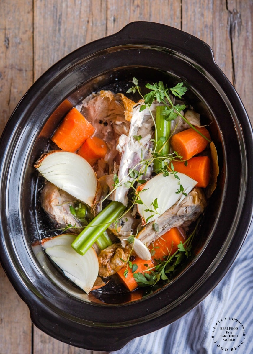 Crockpot Turkey Stock - don't throw away those leftovers. Bone broth is one of the healthiest stocks you can make #stock #bonebroth #turkey #thanksgiving