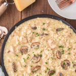 Creamy Chicken and Mushroom Risotto with Herbed Butter Large skillet of mushroom risotto with chunks of chicken