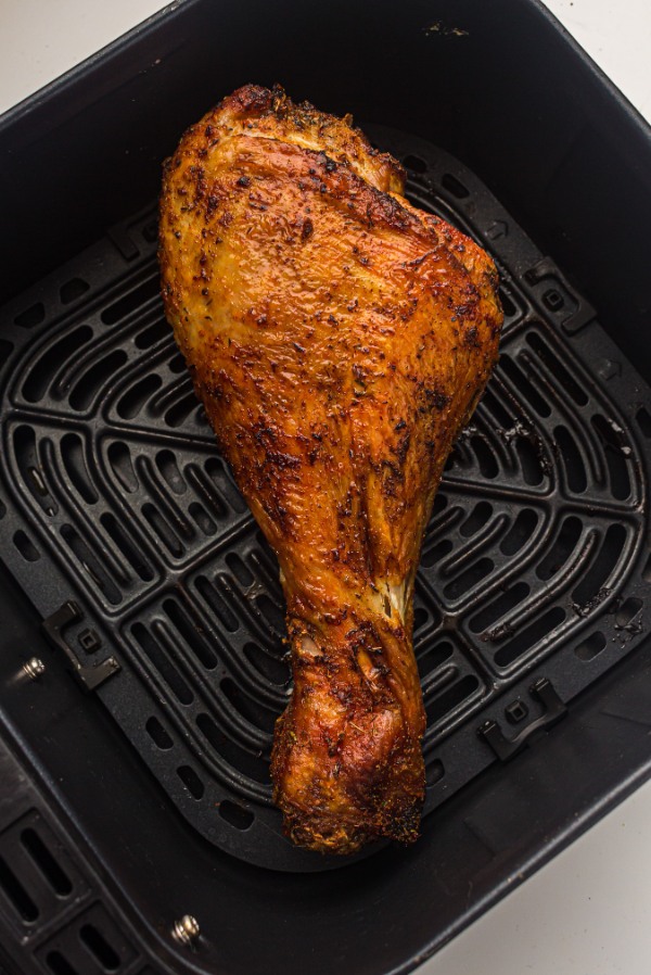 a crispy seasoned turkey leg in the air fryer cooked until golden brown and juicy inside